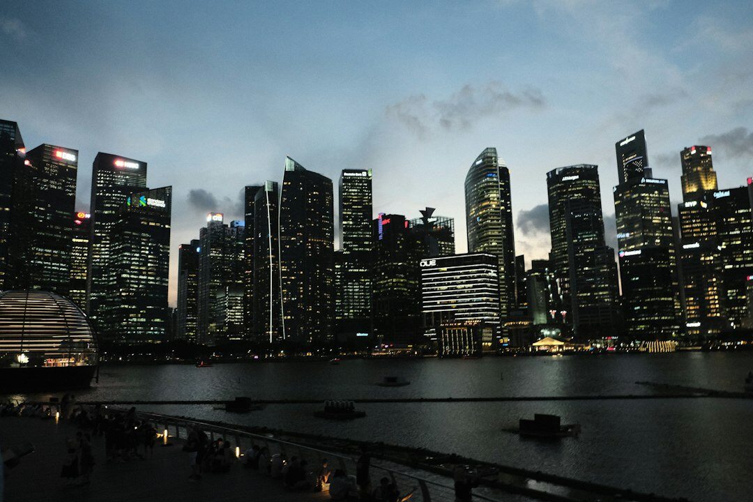 Singapore business district skyline with modern skyscrapers at dusk