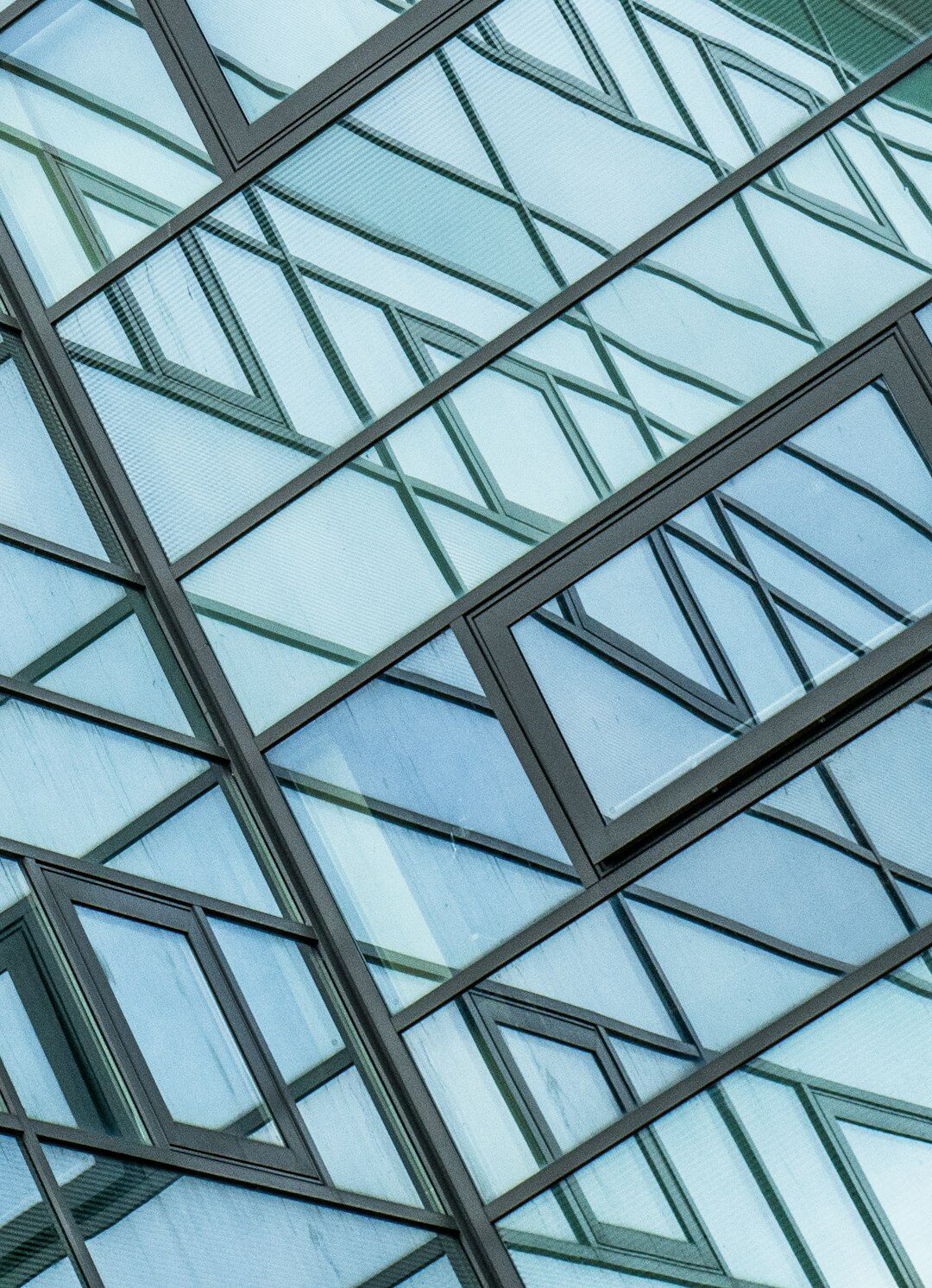 Detailed geometric pattern of a modern glass office building facade